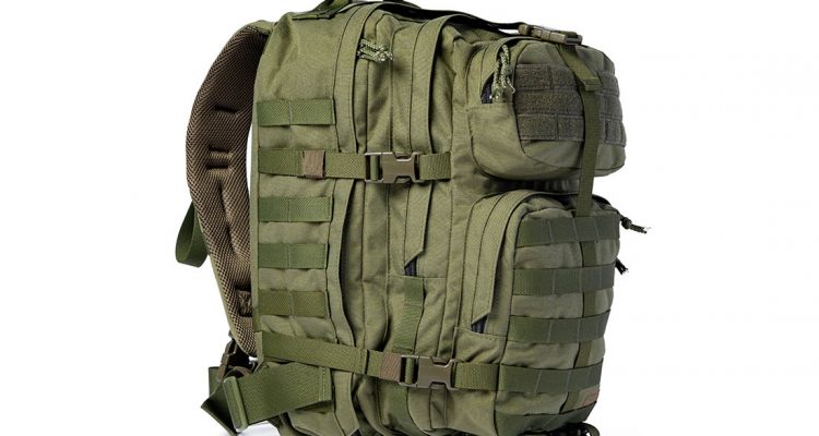 Military backpack isolated on a white background, close up